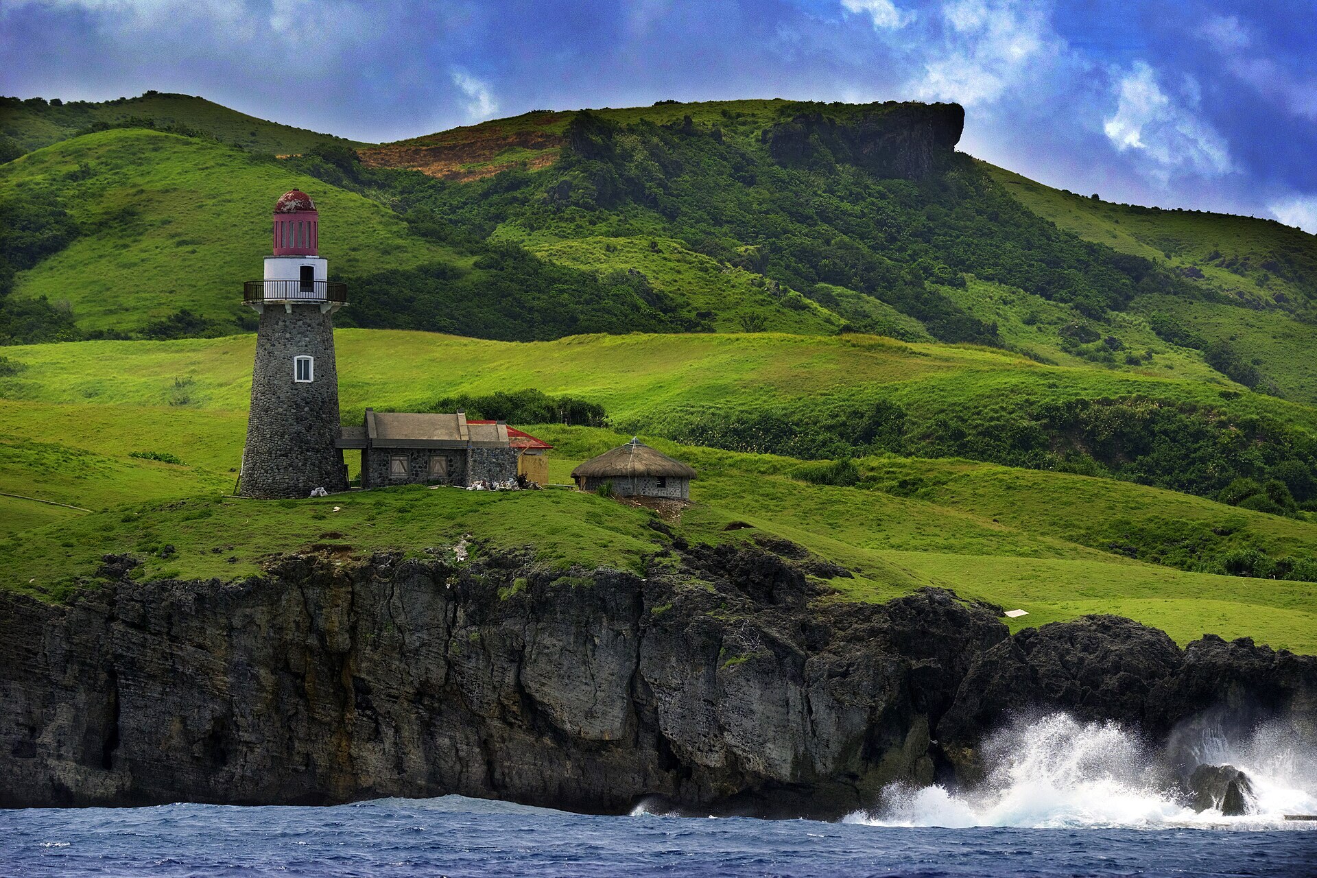 Sabtang lighthouse on its cliff above breaking surf